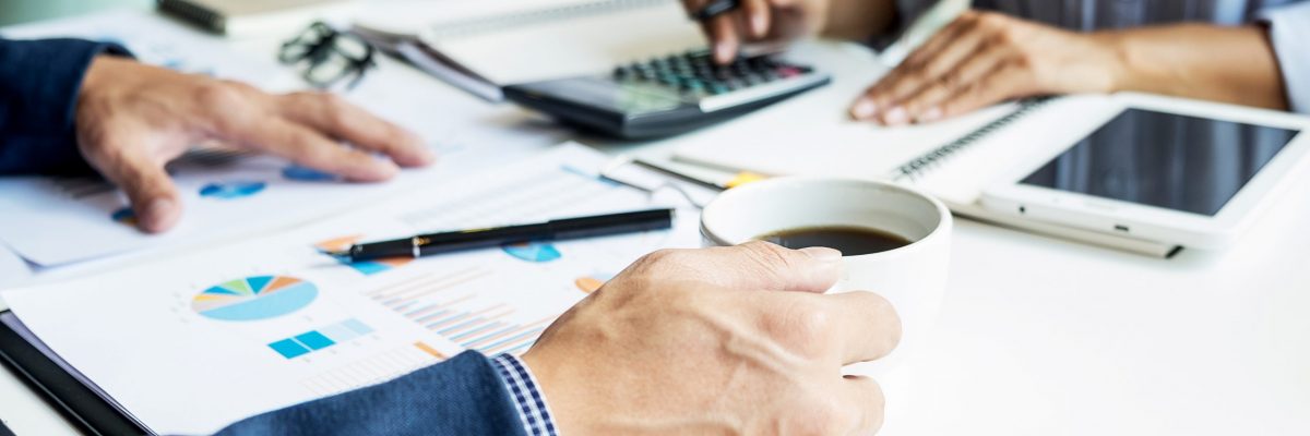 business man financial inspector and secretary making report, calculating or checking balance. Internal Revenue Service inspector checking document. Audit concept